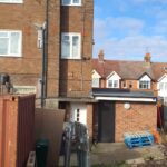 A red brick building with loft ladders.