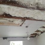 A room with a ceiling covered in white foam insulation.