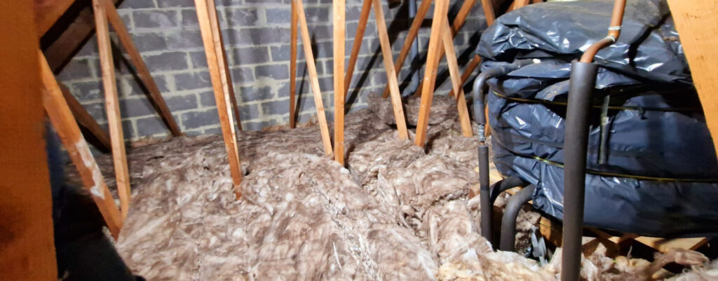 A bag of insulation in a loft.
