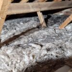 An attic with a lot of spray foam insulation.