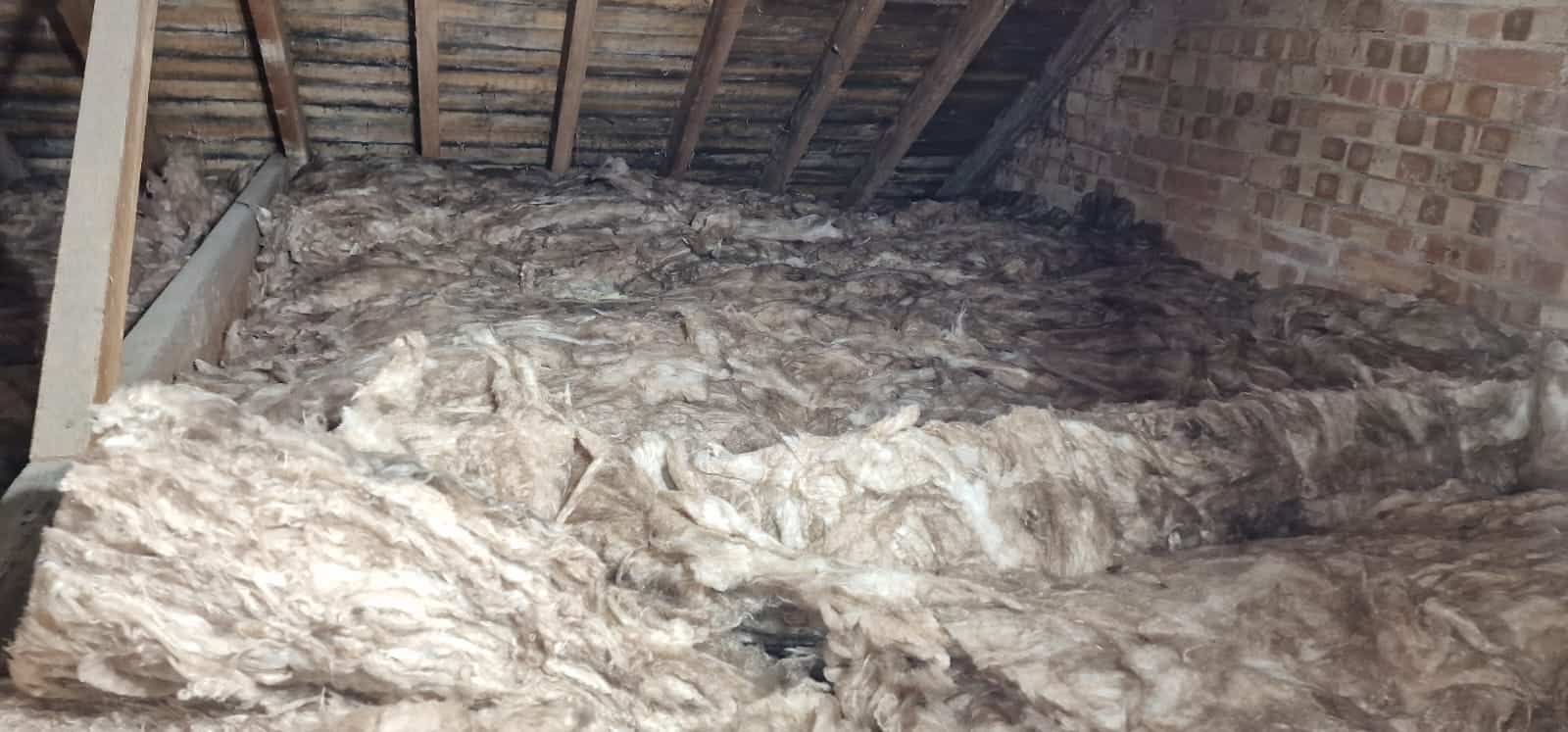 Insulation material installed in a loft space for energy efficiency.