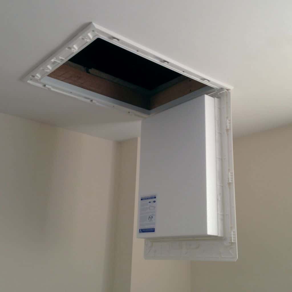 Loft insulation hatch with access panel for attic insulation installation.