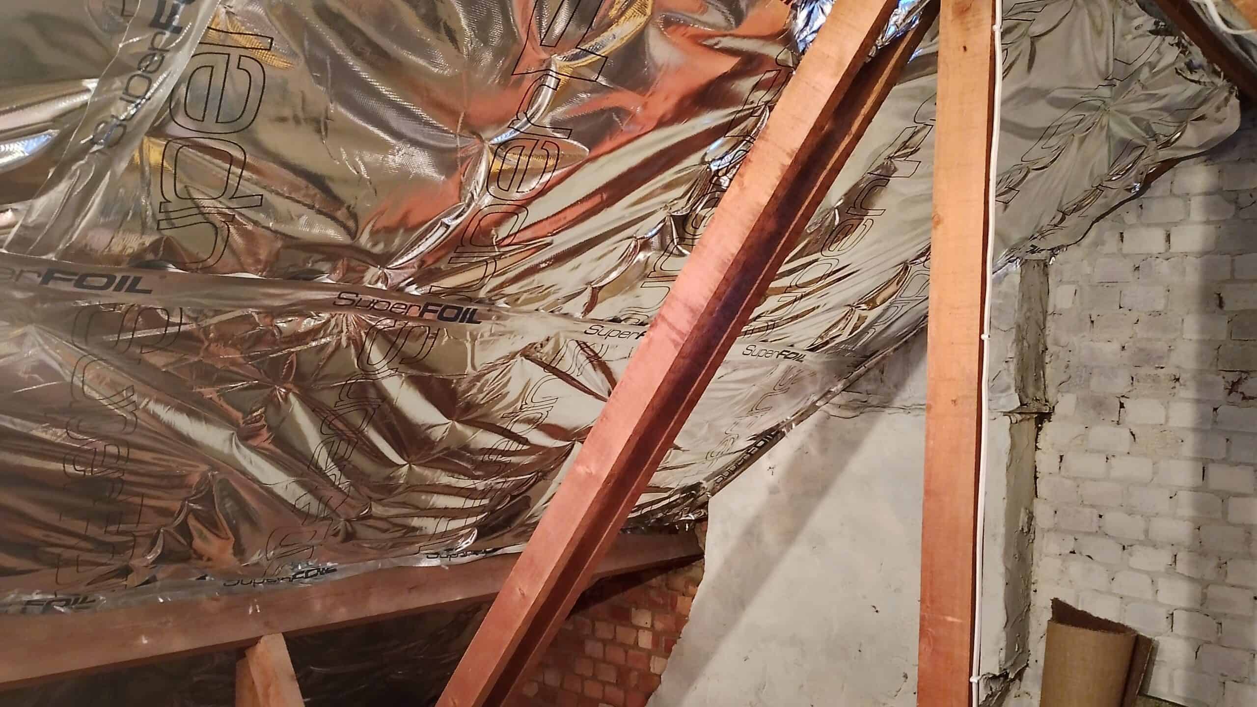 Superfoil Insulation being installed in a loft space.