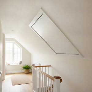 Attic hatch with insulation in a modern home loft space.
